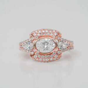 Oval Center Solitaire with Side Pear Diamonds in Regular Setting