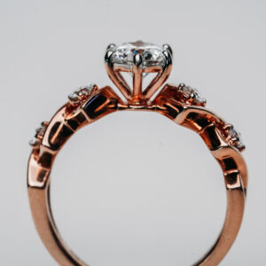 Round Solitaire Ring in Rose Gold with Four Side Round Diamonds in Diamond-Shaped Setting